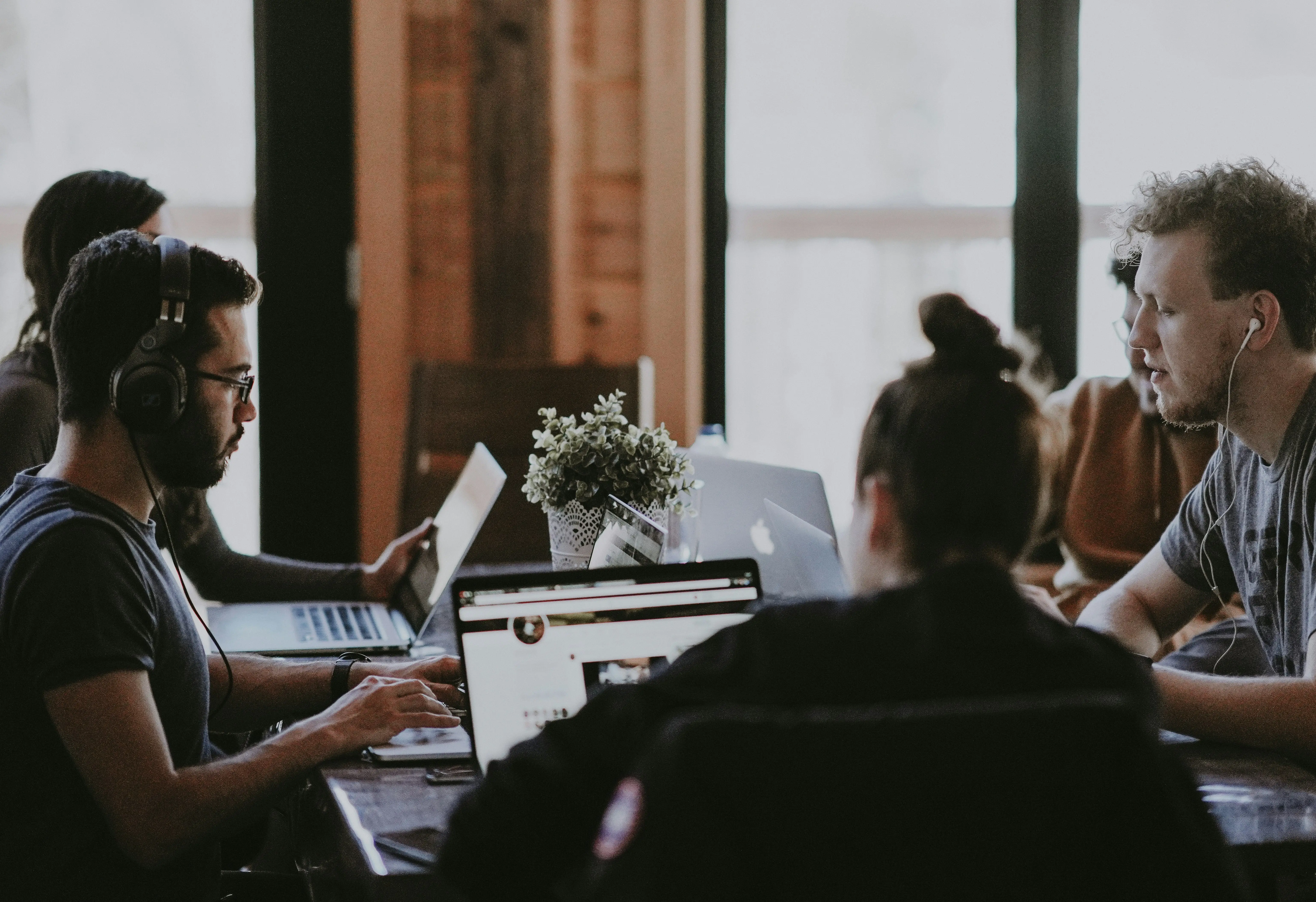 Team collaborating on Looker Studio dashboard in a modern workspace